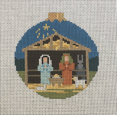 Susan Roberts needlepoint canvas of a Christmas ornament with the nativity stable and creche and the star