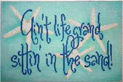 Associated Talents needlepoint canvas of the saying "ain't life grand sittin' in the sand!" in blue on an aqua background with starfish